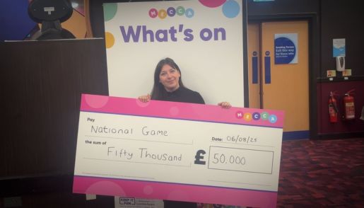 Michelle Duffy, assistant manager at Acocks Green club, holding the £50k Cheque